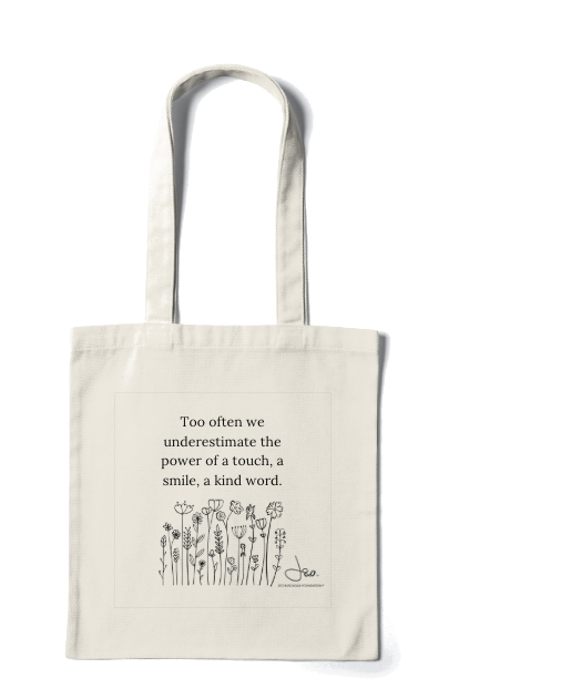 Natural canvas tote printed with a wildflower drawing and the words Too often we underestimate the power of a touch, a smile, a kind word